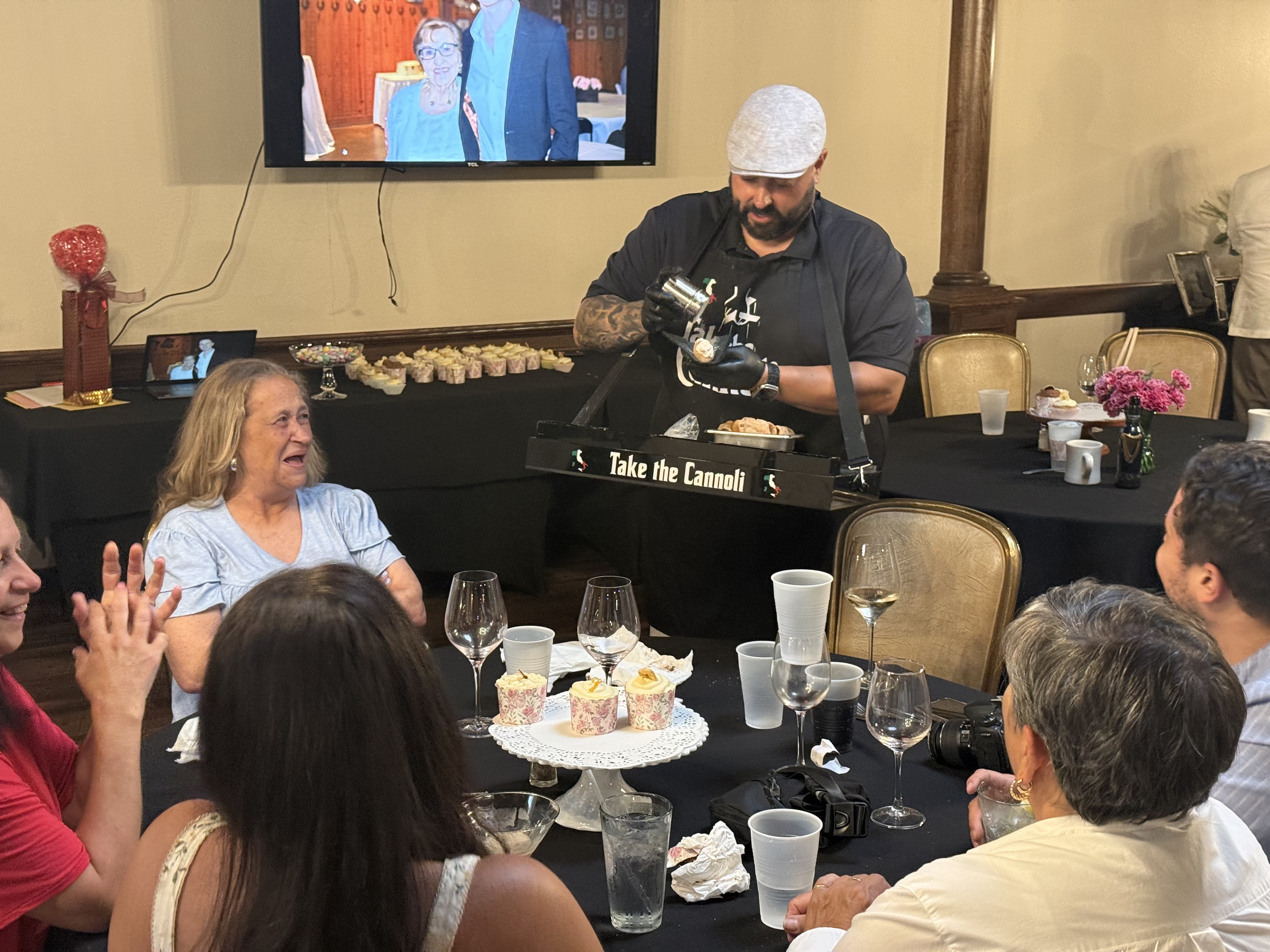 Frank filling cannoli tableside for guests